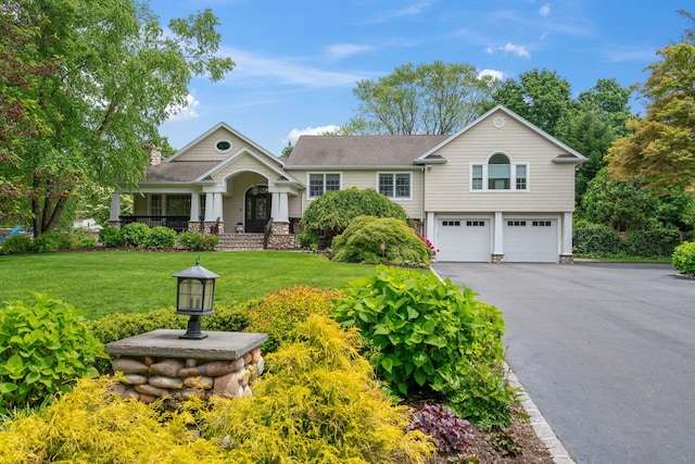 30 Salem Ridge Dr, Huntington, NY 11743 - view of front of home featuring a garage, a porch, driveway, and a front lawn