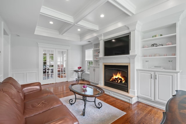 30 Salem Ridge Dr, Huntington, NY 11743 - living area with crown molding, french doors, wood finished floors, a warm lit fireplace, and coffered ceiling