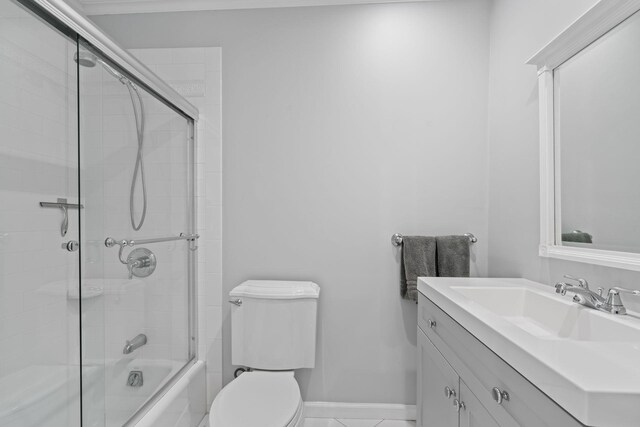 30 Salem Ridge Dr, Huntington, NY 11743 - full bath with toilet, vanity, shower / bath combination with glass door, and baseboards