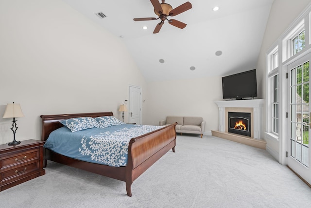 30 Salem Ridge Dr, Huntington, NY 11743 - carpeted bedroom with a warm lit fireplace, a ceiling fan, access to exterior, and high vaulted ceiling