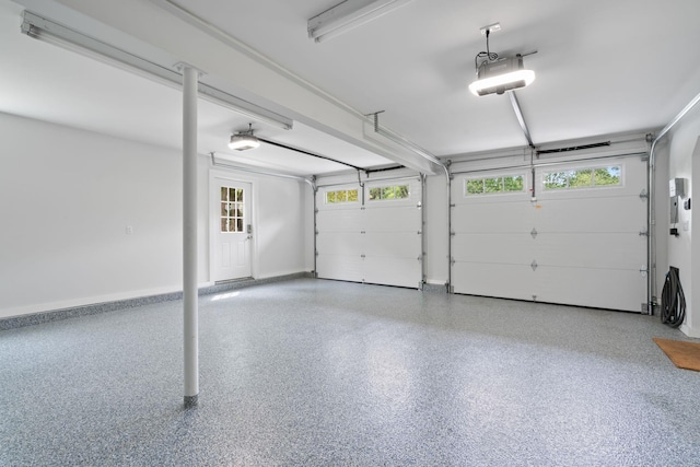 30 Salem Ridge Dr, Huntington, NY 11743 - garage featuring a garage door opener and baseboards