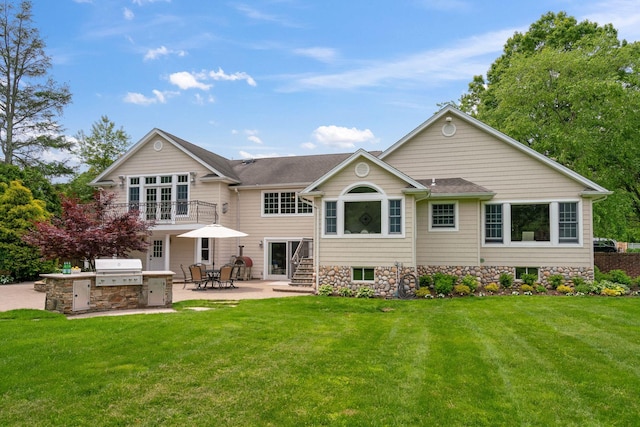 30 Salem Ridge Dr, Huntington, NY 11743 - back of property featuring area for grilling, a lawn, a patio area, and roof with shingles