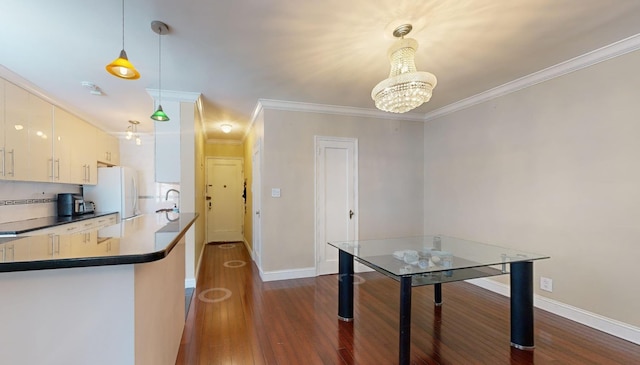9410 64th Rd Unit B6, Rego Park, NY 11374 - kitchen featuring dark wood-type flooring, freestanding refrigerator, ornamental molding, dark countertops, and baseboards