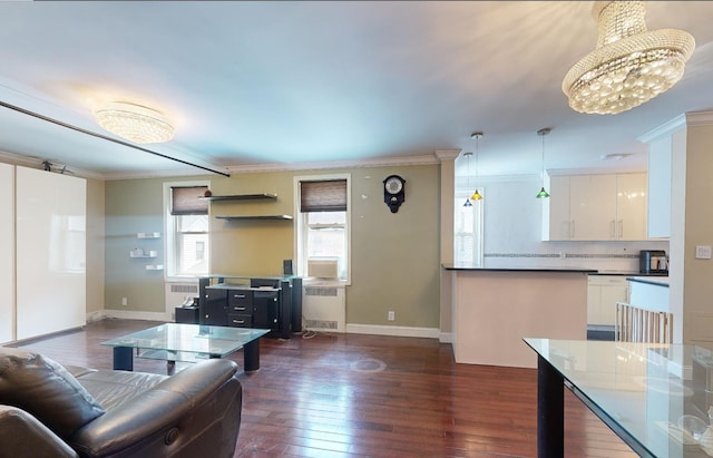 9410 64th Rd Unit B6, Rego Park, NY 11374 - living area with radiator heating unit, ornamental molding, dark wood-type flooring, baseboards, and a chandelier