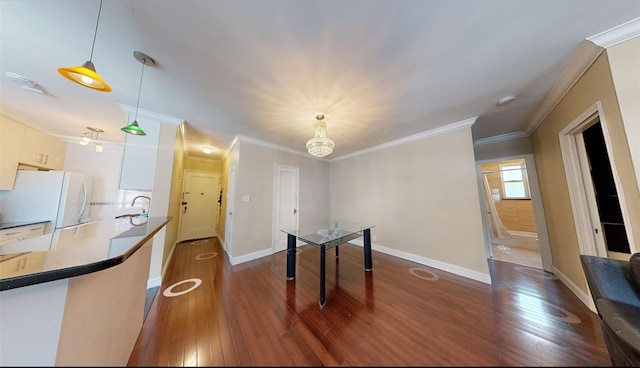 9410 64th Rd Unit B6, Rego Park, NY 11374 - unfurnished dining area with dark wood finished floors, crown molding, a sink, and baseboards