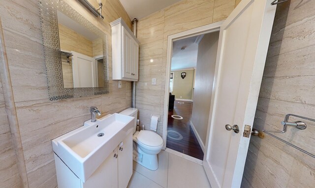 9410 64th Rd Unit B6, Rego Park, NY 11374 - bathroom with toilet, vanity, and tile walls