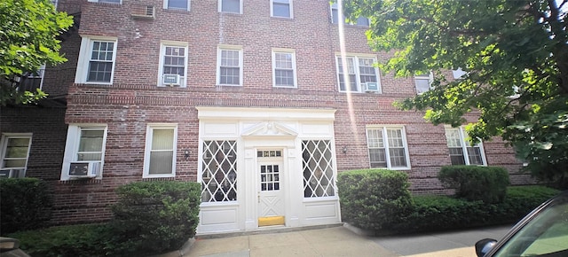 9410 64th Rd Unit B6, Rego Park, NY 11374 - entrance to property with brick siding and cooling unit
