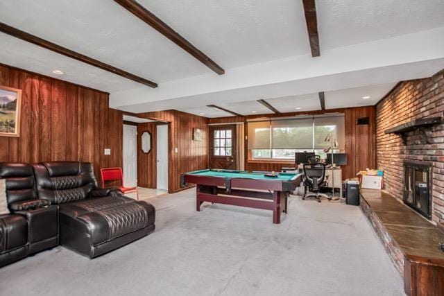127 Parkview Rd, Elmsford, NY 10523 - playroom featuring beam ceiling, light carpet, wood walls, pool table, and a brick fireplace