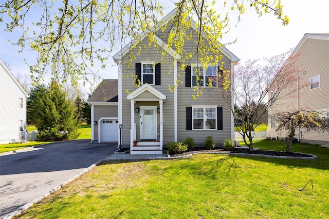 19 Bush Creek Ln, Poughquag, NY 12570 - traditional-style house featuring an attached garage, asphalt driveway, and a front lawn