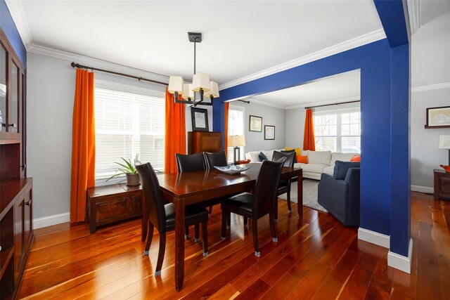 19 Bush Creek Ln, Poughquag, NY 12570 - dining area featuring a chandelier, dark wood finished floors, crown molding, and baseboards