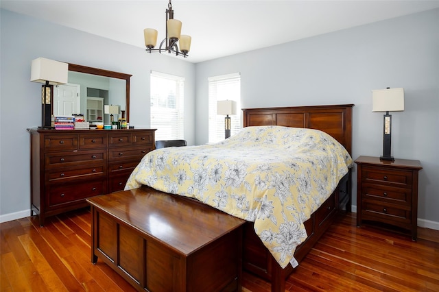 19 Bush Creek Ln, Poughquag, NY 12570 - bedroom with dark wood-style flooring, a chandelier, and baseboards