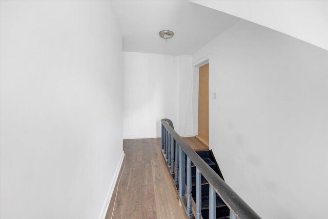 17 Lamartine Ave, Yonkers, NY 10701 - hall featuring an upstairs landing, wood finished floors, and baseboards