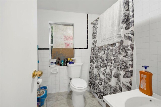 17 Lamartine Ave, Yonkers, NY 10701 - full bathroom featuring tile walls, toilet, and a shower with shower curtain