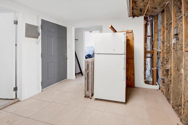 17 Lamartine Ave, Yonkers, NY 10701 - kitchen with freestanding refrigerator, electric panel, and light tile patterned floors