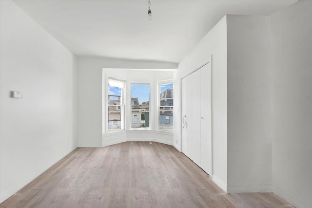 17 Lamartine Ave, Yonkers, NY 10701 - empty room with wood finished floors and baseboards