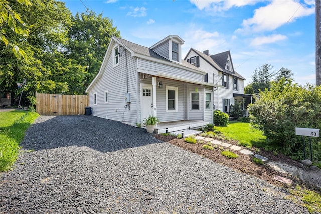 68 Silver Spring Rd, New Windsor, NY 12553 - view of front of house with a porch, driveway, and a gate