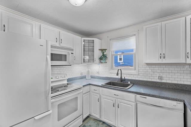 68 Silver Spring Rd, New Windsor, NY 12553 - kitchen with white appliances, white cabinets, decorative backsplash, and dark countertops