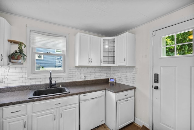 68 Silver Spring Rd, New Windsor, NY 12553 - kitchen with dishwasher, dark countertops, white cabinets, and decorative backsplash