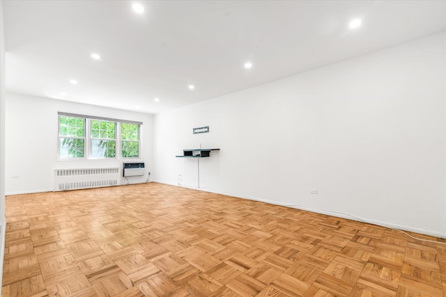 151-15 84th St Unit 1F, Howard Beach, NY 11414 - unfurnished room featuring radiator heating unit, baseboards, and recessed lighting