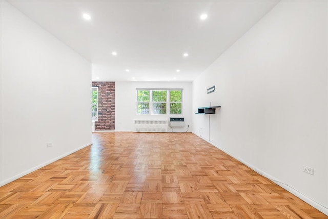 151-15 84th St Unit 1F, Howard Beach, NY 11414 - unfurnished living room with radiator, baseboards, a wall mounted air conditioner, and recessed lighting
