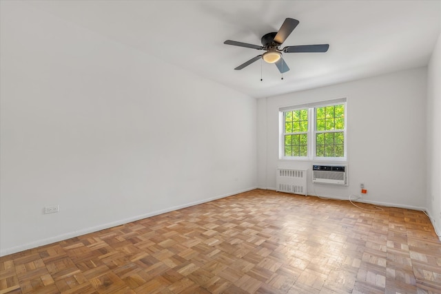 151-15 84th St Unit 1F, Howard Beach, NY 11414 - spare room with radiator, baseboards, a ceiling fan, and an AC wall unit