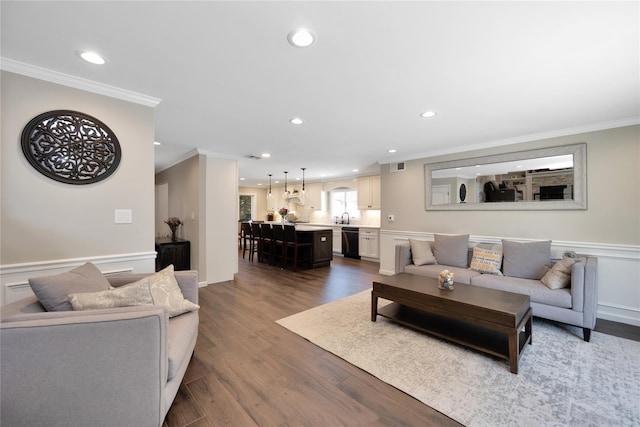 2985 Cheryl Rd, Merrick, NY 11566 - living room featuring ornamental molding, recessed lighting, dark wood-style flooring, and wainscoting
