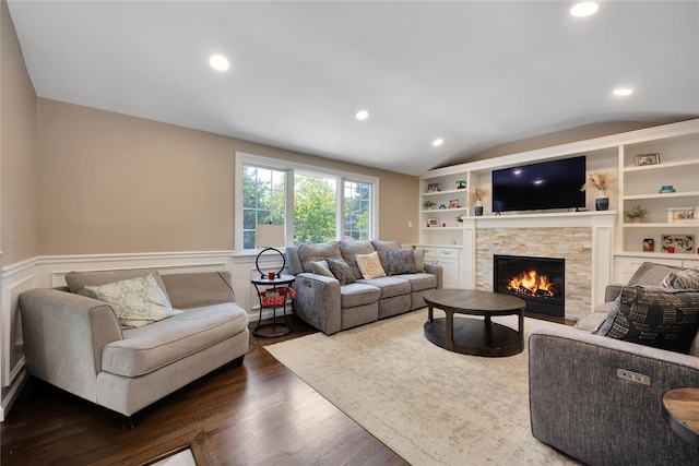 2985 Cheryl Rd, Merrick, NY 11566 - living area featuring lofted ceiling, a fireplace, a wainscoted wall, dark wood-style floors, and recessed lighting