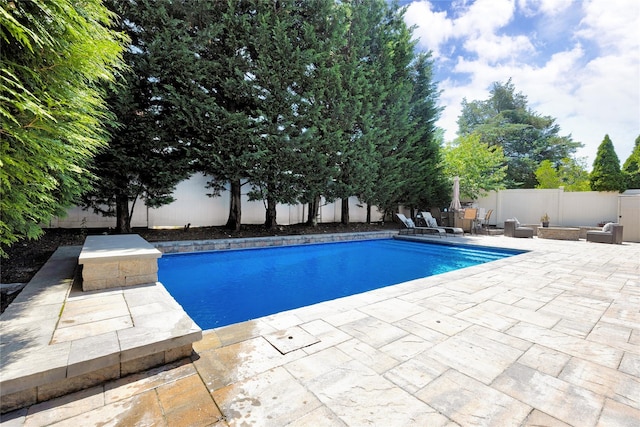2985 Cheryl Rd, Merrick, NY 11566 - view of pool with a patio, a fenced backyard, and a fire pit