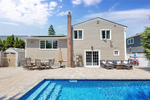 2985 Cheryl Rd, Merrick, NY 11566 - rear view of house with an outdoor hangout area, a patio area, a chimney, and outdoor dining area