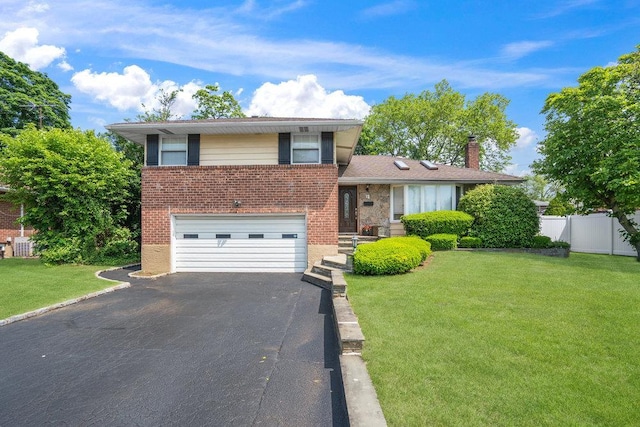 18 Birchwood Park Dr, Syosset, NY 11791 - split level home with brick siding, an attached garage, asphalt driveway, and a chimney