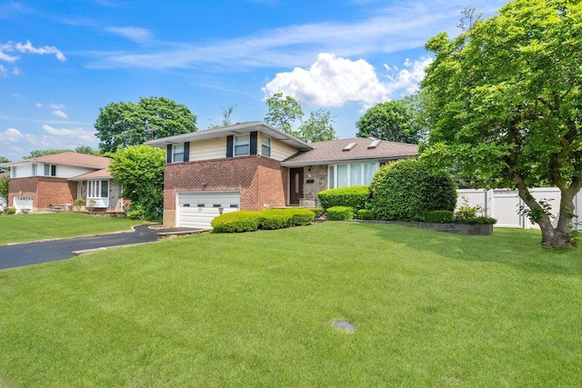18 Birchwood Park Dr, Syosset, NY 11791 - split level home featuring brick siding, an attached garage, and asphalt driveway