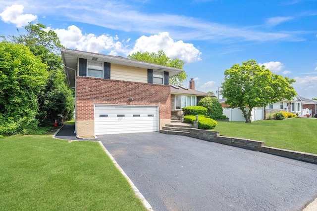 18 Birchwood Park Dr, Syosset, NY 11791 - split level home with a garage, brick siding, driveway, and a front yard