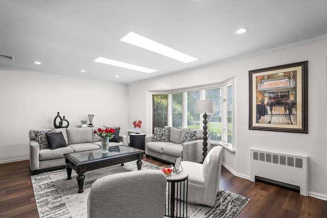 18 Birchwood Park Dr, Syosset, NY 11791 - living room featuring radiator, crown molding, baseboards, wood finished floors, and recessed lighting