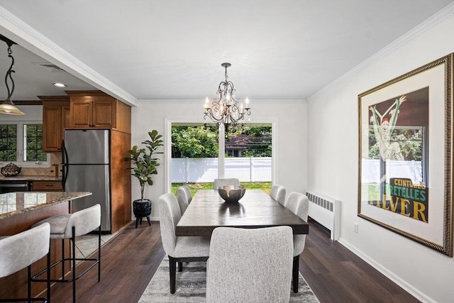 18 Birchwood Park Dr, Syosset, NY 11791 - dining area featuring radiator heating unit, a chandelier, dark wood-style flooring, crown molding, and baseboards