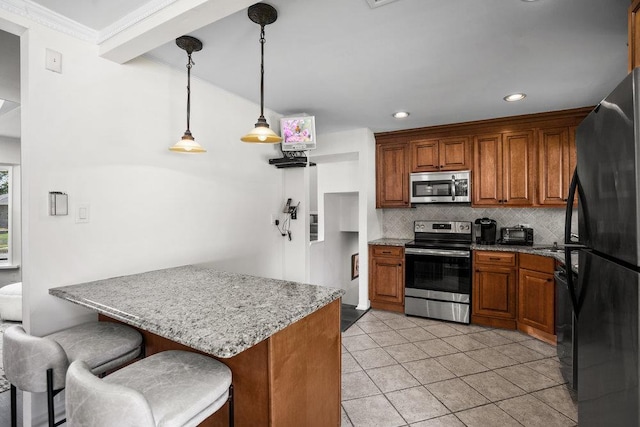18 Birchwood Park Dr, Syosset, NY 11791 - kitchen featuring appliances with stainless steel finishes, brown cabinetry, tasteful backsplash, a breakfast bar area, and light stone counters