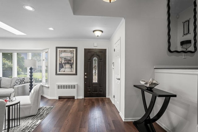 18 Birchwood Park Dr, Syosset, NY 11791 - entryway with radiator heating unit, dark wood-style floors, baseboards, ornamental molding, and recessed lighting