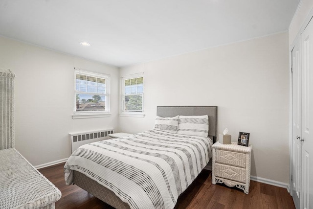 18 Birchwood Park Dr, Syosset, NY 11791 - bedroom featuring radiator, wood finished floors, baseboards, a closet, and recessed lighting