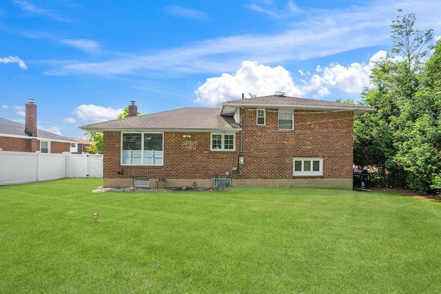 18 Birchwood Park Dr, Syosset, NY 11791 - back of house with brick siding and cooling unit