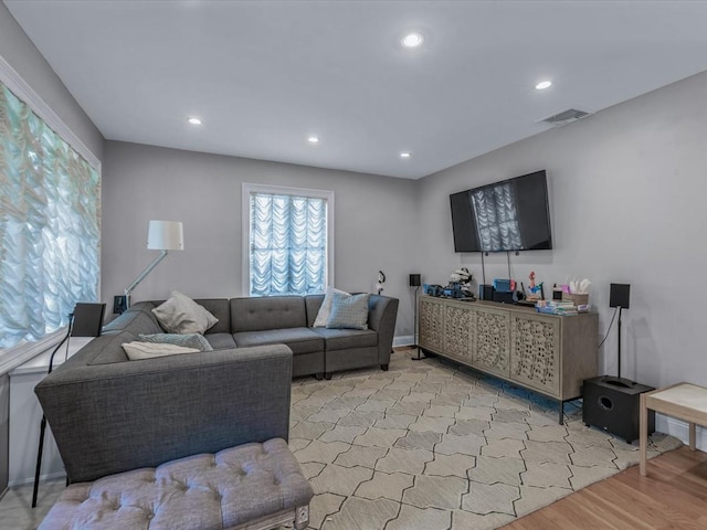 18 Ashland Ave, New Hyde Park, NY 11040 - living area with light wood-type flooring, recessed lighting, and baseboards