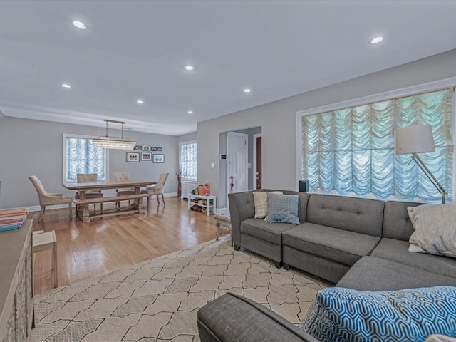 18 Ashland Ave, New Hyde Park, NY 11040 - living area with light wood-style flooring, recessed lighting, and baseboards