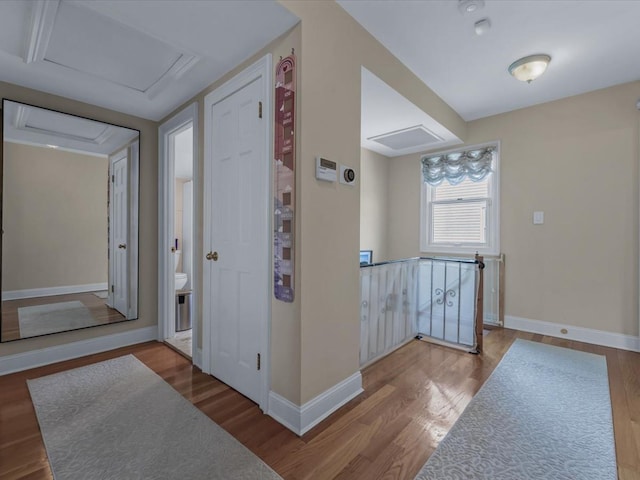 18 Ashland Ave, New Hyde Park, NY 11040 - hallway featuring attic access and wood finished floors