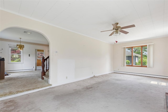 1295 Washington Ave, Greenport, NY 11944 - carpeted spare room with arched walkways, baseboard heating, crown molding, ceiling fan, and stairway