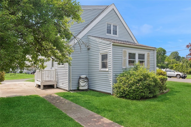 1295 Washington Ave, Greenport, NY 11944 - view of property exterior featuring a lawn