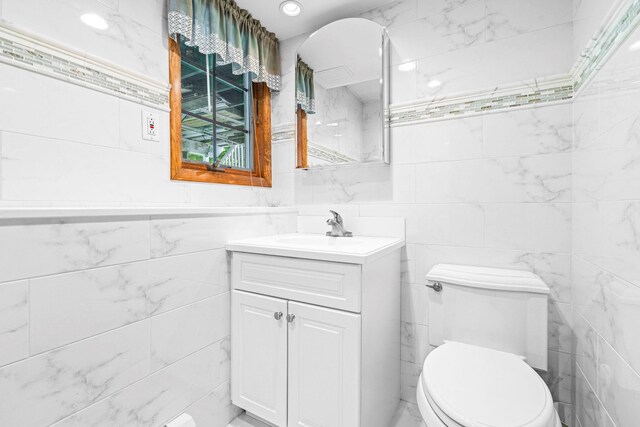 2A Suffern Ln, Garnerville, NY 10923 - bathroom featuring tile walls, vanity, and toilet