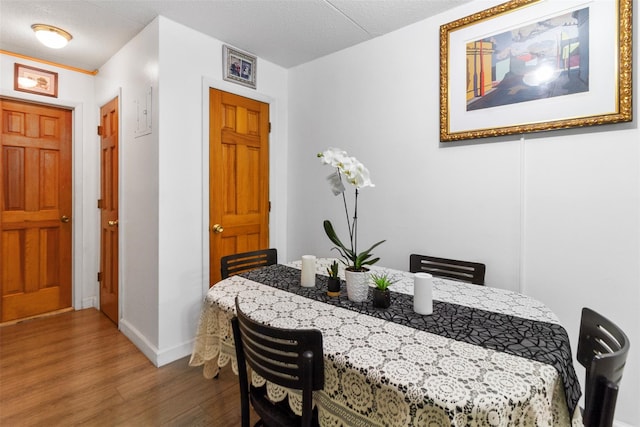 200 Diplomat Dr Unit 3D, Mount Kisco, NY 10549 - dining space featuring wood finished floors and baseboards