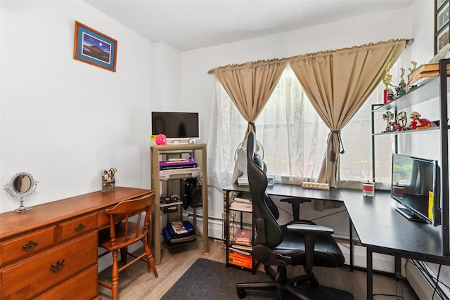 200 Diplomat Dr Unit 3D, Mount Kisco, NY 10549 - home office with wood finished floors, baseboard heating, and a baseboard radiator