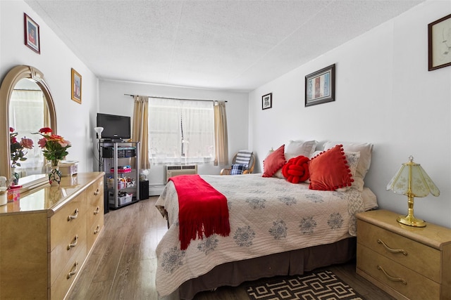 200 Diplomat Dr Unit 3D, Mount Kisco, NY 10549 - bedroom featuring wood finished floors and a textured ceiling
