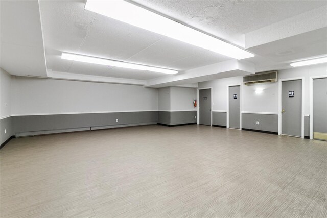200 Diplomat Dr Unit 3D, Mount Kisco, NY 10549 - below grade area with a wall unit AC and baseboard heating