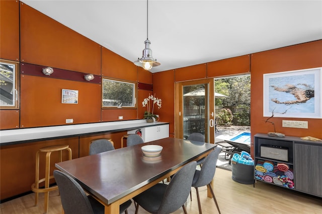 521 Fire Island Blvd, Fire Island Pines, NY 11782 - dining space featuring light wood finished floors and vaulted ceiling
