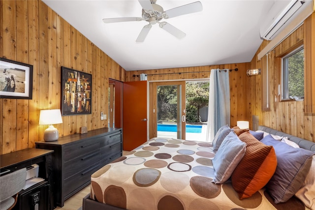 521 Fire Island Blvd, Fire Island Pines, NY 11782 - bedroom featuring wooden walls, a wall mounted AC, vaulted ceiling, access to exterior, and a ceiling fan